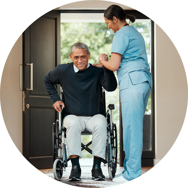 Caregiver helping man in his wheelchair